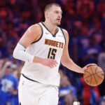 Denver Nuggets center Nikola Jokic (15) dribbles down the court against the Oklahoma City Thunder in the second quarter during game seven of the second round for the 2025 NBA Playoffs at Paycom Center.