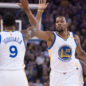 January 4, 2017; Oakland, CA, USA; Golden State Warriors forward Kevin Durant (35) celebrates with forward Andre Iguodala (9) against the Portland Trail Blazers during the first quarter at Oracle Arena.
