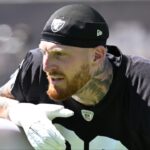 Las Vegas Raiders defensive end Maxx Crosby (98) looks on during the team stretch during Las Vegas Raiders Minicamp at Intermountain Health Performance Center.