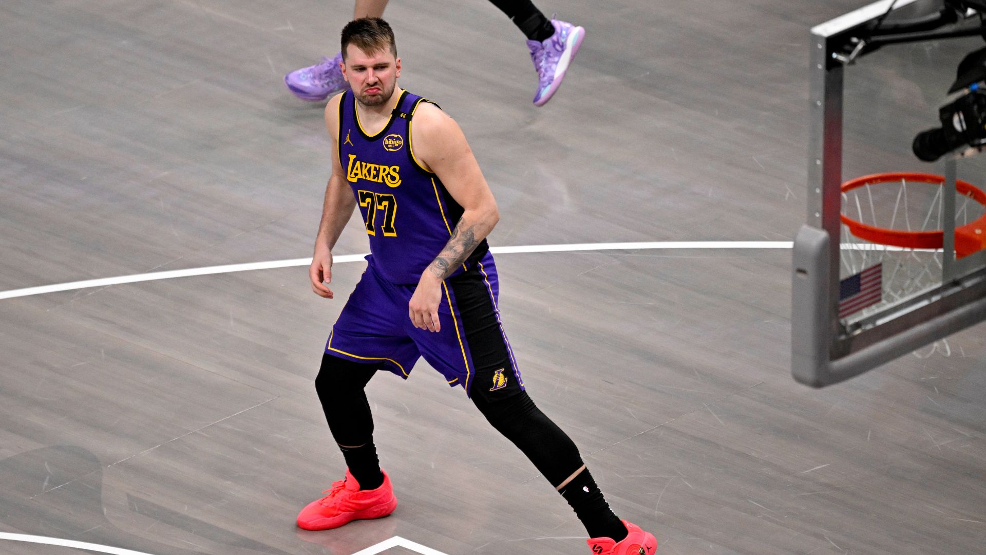 Apr 9, 2025; Dallas, Texas, USA; Los Angeles Lakers guard Luka Doncic (77) celebrates after making a basket Dallas Mavericks during the fourth quarter at the American Airlines Center.