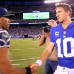 Seattle Seahawks quarterback Russell Wilson (3) shakes hands with New York Giants quarterback Eli Manning (10) after a game at MetLife Stadium.