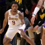 Los Angeles Lakers guard Bronny James (9) defends on the court in the second half against the Minnesota Timberwolves at Crypto.com Arena.