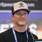 May 4, 2025; Fort Worth, Texas, USA; Driver Kasey Kahne speaks to the media before the start of the Wurth 400 race at Texas Motor Speedway. Mandatory Credit: Jerome Miron-Imagn Images