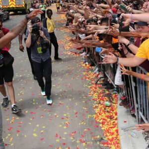Cleveland Cavaliers Kyrie Irving celebrates with the crowd in downtown Cleveland Cleveland Cavaliers Kyrie Irving celebrates with the crowd during a parade to celebrate winning the 2016 NBA Championship in downtown Cleveland, Ohio.