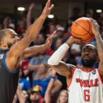 The Ville's Russ Smith (6) goes for a three pointer against La Familia's Aaron Harrison (32) during their game on Monday, July 29, 2024 at Freedom Hall in Louisville, Ky. during the quarter finals of The Basketball Tournament.