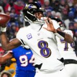 Jan 19, 2025; Orchard Park, New York, USA; Baltimore Ravens quarterback Lamar Jackson (8) drops back to pass during the first quarter against the Buffalo Bills in a 2025 AFC divisional round game at Highmark Stadium.