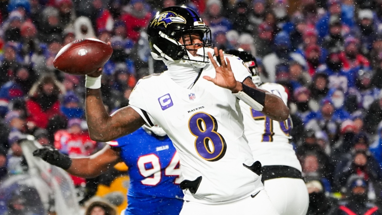 Jan 19, 2025; Orchard Park, New York, USA; Baltimore Ravens quarterback Lamar Jackson (8) drops back to pass during the first quarter against the Buffalo Bills in a 2025 AFC divisional round game at Highmark Stadium.
