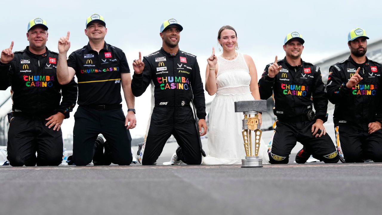 NASCAR Cup Series driver Bubba Wallace (23) celebrates on the yard of bricks Sunday, July 27, 2025, during the Brickyard 400 at Indianapolis Motor Speedway.