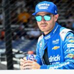 NASCAR Cup Series driver Kyle Larson (5) rides in a truck Sunday, July 27, 2025, ahead of the Brickyard 400 at Indianapolis Motor Speedway.
