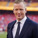 NBC Sports analyst Chris Simms on field prior to a game between the Kansas City Chiefs and Detroit Lions at GEHA Field at Arrowhead Stadium.