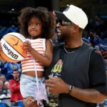 Former basketball player Dwyane Wade attends a WNBA game between the Chicago Sky and Connecticut Sun at Wintrust Arena.
