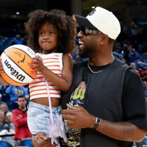 Former basketball player Dwyane Wade attends a WNBA game between the Chicago Sky and Connecticut Sun at Wintrust Arena.