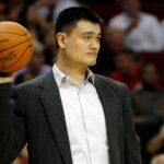 Houston Rockets center Yao Ming (11) on the sidelines against the Dallas Mavericks in the fourth quarter at the Toyota Center. The Mavericks defeated the Rockets 98-91