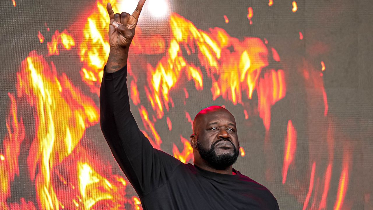 Shaquille O'Neal holds up the sign of the horns during a DJ performance ahead of the College Football Playoff semifinal game between the Texas Longhorns and Ohio State in the Cotton Bowl at AT&T Stadium on Friday, Jan. 10, 2024 in Arlington, Texas.