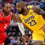 Los Angeles Lakers forward LeBron James (23) moves the ball against Los Angeles Clippers forward Kawhi Leonard (2) during the second half at Intuit Dome.