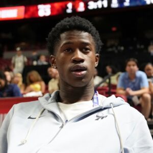 Philadelphia 76ers guard VJ Edgecombe (77) watches the game against the San Antonio Spurs from the baseline at Thomas & Mack Center.