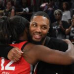 Las Vegas Aces guard Chelsea Gray (12) hugs NBA player Damian Lillard after her game against the Los Angeles Sparks at Michelob Ultra Arena.