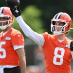 Cleveland Browns quarterback Kenny Pickett (8) throws a pass as quarterback Joe Flacco (15) looks on during minicamp at CrossCountry Mortgage Campus.