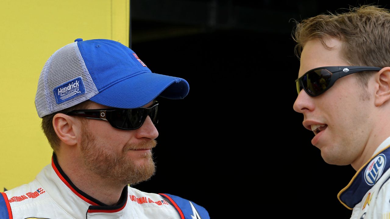 NASCAR Sprint Cup Series driver Dale Earnhardt Jr (left) talks to Brad Keselowski during the Subway Fresh Fit 500 at Phoenix International Raceway.