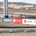 Cars are held in line with a caution flag during the NASCAR Xfinity Series DoorDash 250 at Sonoma Raceway.