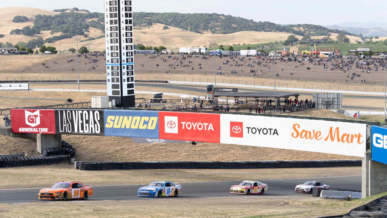 Cars are held in line with a caution flag during the NASCAR Xfinity Series DoorDash 250 at Sonoma Raceway.