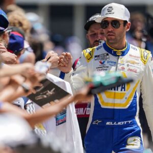 NASCAR Cup Series driver Chase Elliott (9) signs autographs for fans on Sunday, July 27, 2025, ahead of the Brickyard 400 at Indianapolis Motor Speedway.