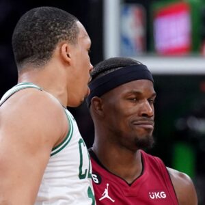 May 19, 2023; Boston, Massachusetts, USA; Boston Celtics forward Grant Williams (12) and Miami Heat forward Jimmy Butler (22) react after a play during the second half of game two of the Eastern Conference Finals for the 2023 NBA playoffs at TD Garden.