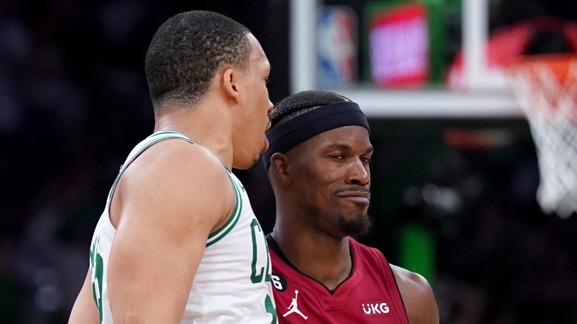 May 19, 2023; Boston, Massachusetts, USA; Boston Celtics forward Grant Williams (12) and Miami Heat forward Jimmy Butler (22) react after a play during the second half of game two of the Eastern Conference Finals for the 2023 NBA playoffs at TD Garden.