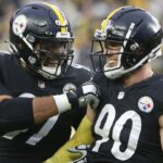 Dec 19, 2021; Pittsburgh, Pennsylvania, USA; Pittsburgh Steelers defensive end Cameron Heyward (97) and outside linebacker T.J. Watt (90) celebrate after a fumble recovery by Watt against the Tennessee Titans during the fourth quarter at Heinz Field. The Steelers won 19-13.