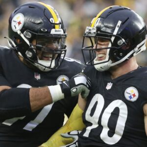 Dec 19, 2021; Pittsburgh, Pennsylvania, USA; Pittsburgh Steelers defensive end Cameron Heyward (97) and outside linebacker T.J. Watt (90) celebrate after a fumble recovery by Watt against the Tennessee Titans during the fourth quarter at Heinz Field. The Steelers won 19-13.