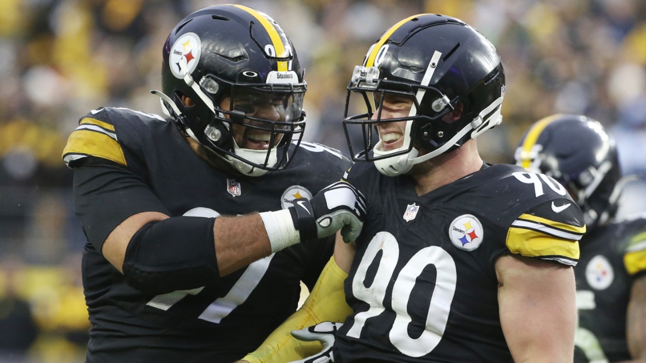 Dec 19, 2021; Pittsburgh, Pennsylvania, USA; Pittsburgh Steelers defensive end Cameron Heyward (97) and outside linebacker T.J. Watt (90) celebrate after a fumble recovery by Watt against the Tennessee Titans during the fourth quarter at Heinz Field. The Steelers won 19-13.