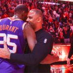 Phoenix Suns forward Kevin Durant (35) hugs Houston Rockets head coach Ime Udoka after a game at Toyota Center.