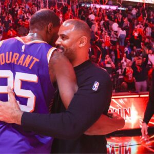 Phoenix Suns forward Kevin Durant (35) hugs Houston Rockets head coach Ime Udoka after a game at Toyota Center.