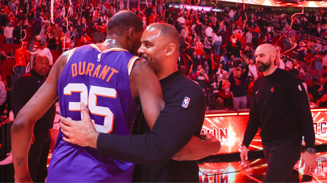 Phoenix Suns forward Kevin Durant (35) hugs Houston Rockets head coach Ime Udoka after a game at Toyota Center.