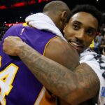 Los Angeles Lakers forward Kobe Bryant (24) hugs Atlanta Hawks guard Jeff Teague (0) after a game at Philips Arena. The Hawks defeated the Lakers 100-87.