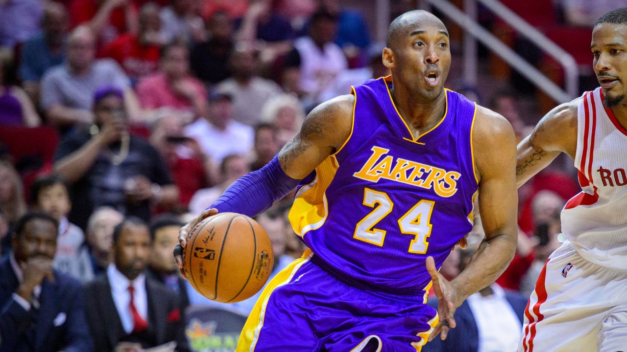 Los Angeles Lakers forward Kobe Bryant (24) and Houston Rockets forward Trevor Ariza (1) in action during the game between the Rockets and the Lakers at the Toyota Center. Bryant plays in the last road game and second to last game of his NBA career.