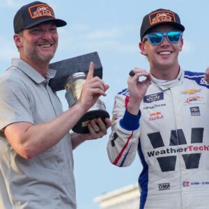 Dale Earnhardt Jr. smiles for a photo with NASCAR Xfinity Series driver Connor Zilisch (88) on Saturday, July 26, 2025, after winning the Pennzoil 250 at Indianapolis Motor Speedway.