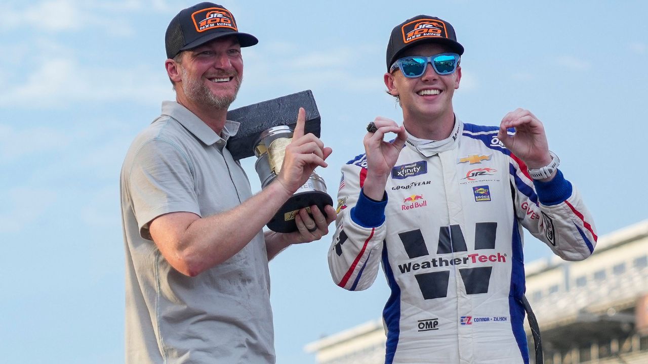 Dale Earnhardt Jr. smiles for a photo with NASCAR Xfinity Series driver Connor Zilisch (88) on Saturday, July 26, 2025, after winning the Pennzoil 250 at Indianapolis Motor Speedway.