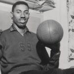 Wilt Chamberlain Smiling with Basketball Vintage 1960 s capture of Wilt Chamberlain smiling while spinning a basketball.