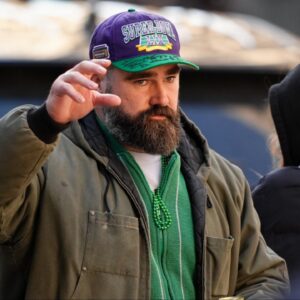 Jason Kelce waves to fans during the Super Bowl LIX championship parade and rally.