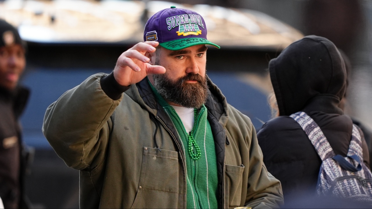 Jason Kelce waves to fans during the Super Bowl LIX championship parade and rally.