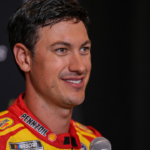 Joey Logano speaks to media members during the NASCAR Playoffs Media Day at the Charlotte Convention Center.