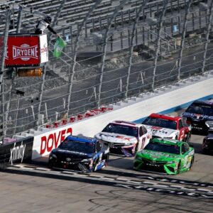 NASCAR Cup Series driver Martin Truex Jr. (19) and NASCAR Cup Series driver Kyle Busch (18) lead a restart during the NASCAR Cup Series at Dover International Speedway.