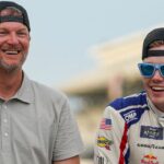 Dale Earnhardt Jr. smiles for a photo with NASCAR Xfinity Series driver Connor Zilisch (88) on Saturday, July 26, 2025, after winning the Pennzoil 250 at Indianapolis Motor Speedway.