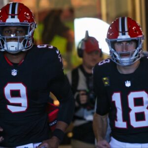 Atlanta Falcons quarterback Michael Penix Jr. (9) and quarterback Kirk Cousins (18) run on the field before a game against the New York Giants at Mercedes-Benz Stadium.