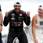 NASCAR Cup Series driver Bubba Wallace (23) celebrates on the yard of bricks Sunday, July 27, 2025, during the Brickyard 400 at Indianapolis Motor Speedway.