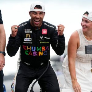 NASCAR Cup Series driver Bubba Wallace (23) celebrates on the yard of bricks Sunday, July 27, 2025, during the Brickyard 400 at Indianapolis Motor Speedway.