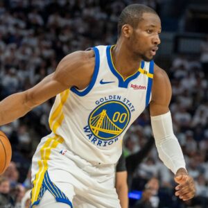 May 8, 2025; Minneapolis, Minnesota, USA; Golden State Warriors forward Jonathan Kuminga (00) dribbles the ball against the Minnesota Timberwolves in the second half during game two of the second round for the 2025 NBA Playoffs at Target Center.