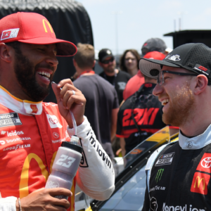 Jun 24, 2023; Nashville, Tennessee, USA; NASCAR Cup Series driver Bubba Wallace (23) and NASCAR Cup Series driver Tyler Reddick (45) talk after their first qualifying run at Nashville Superspeedway. Mandatory Credit: Christopher Hanewinckel-Imagn Images