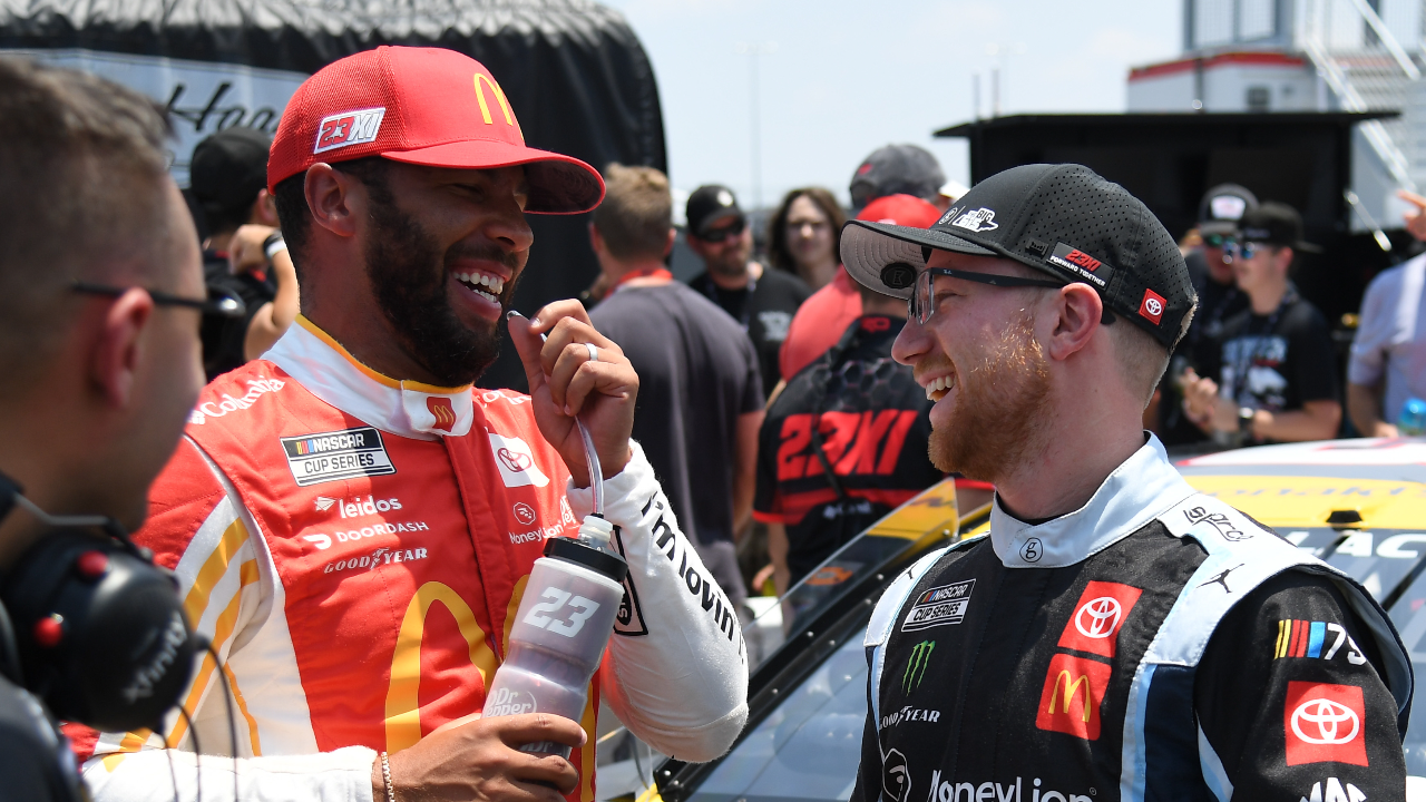 Jun 24, 2023; Nashville, Tennessee, USA; NASCAR Cup Series driver Bubba Wallace (23) and NASCAR Cup Series driver Tyler Reddick (45) talk after their first qualifying run at Nashville Superspeedway. Mandatory Credit: Christopher Hanewinckel-Imagn Images
